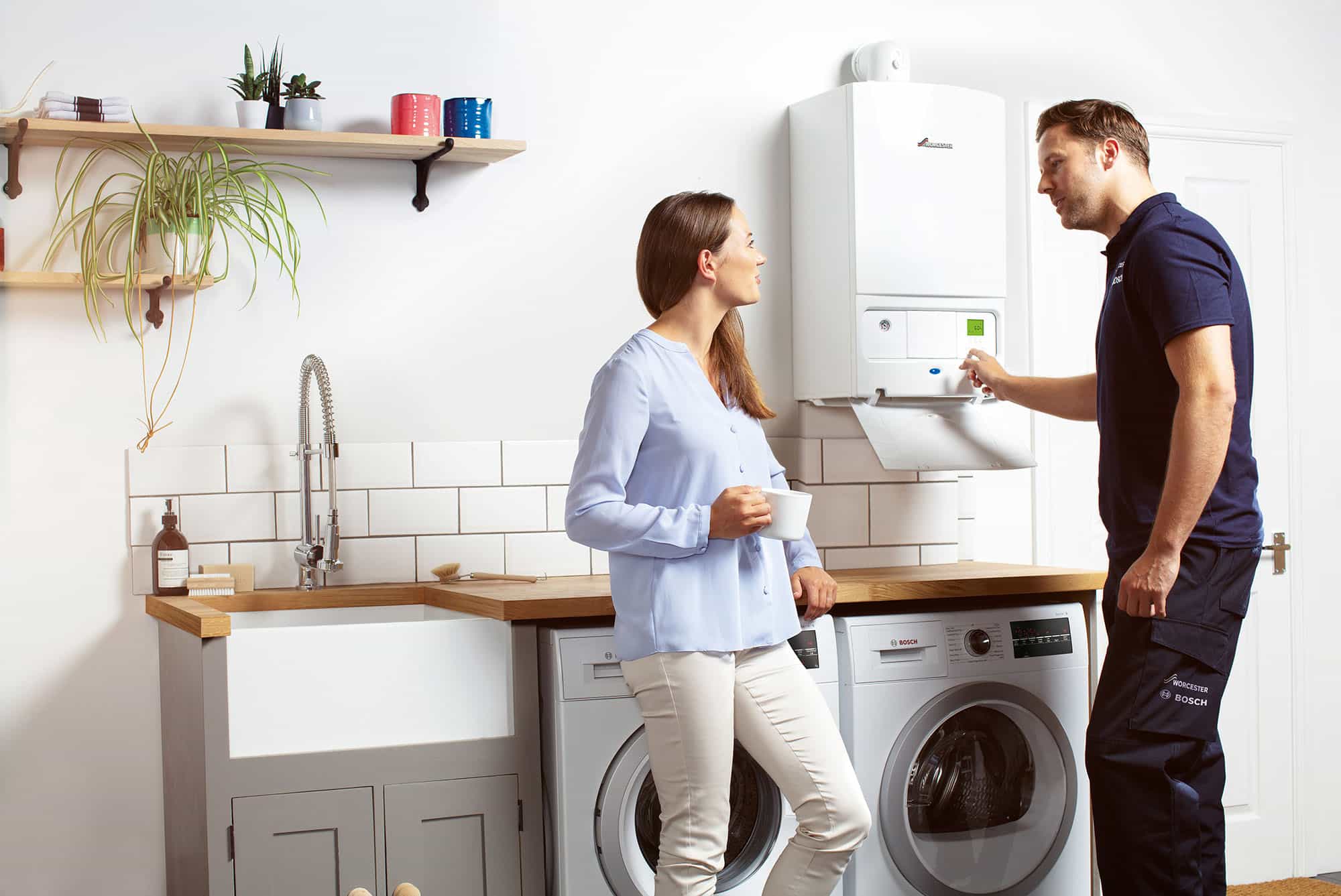 people in kitchen open boiler